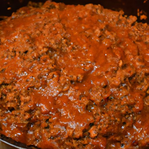 A close-up of a Dutch oven filled with simmering sloppy joes, showcasing the rich and flavorful sauce.